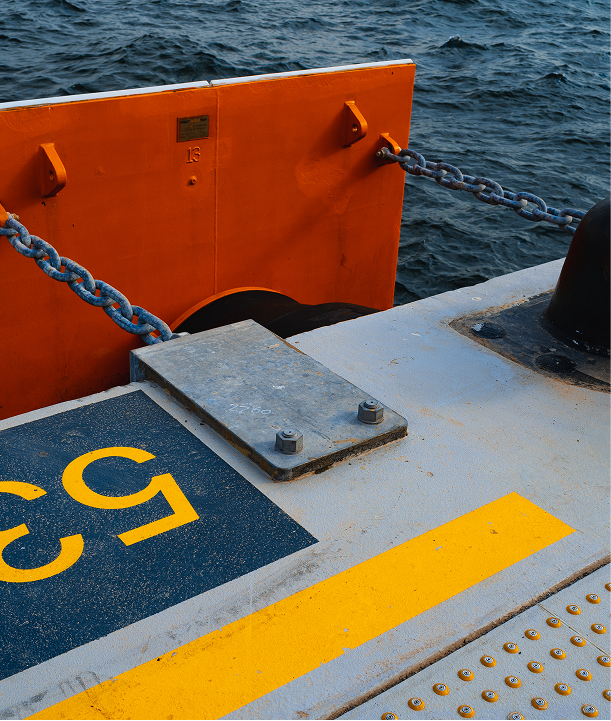 concrete pier with yellow designations close up